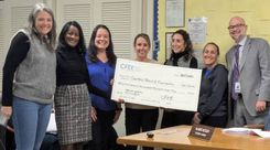 CFEE board members presenting a check to Cranford School Board Superintendent Dr. Scott Rubin.