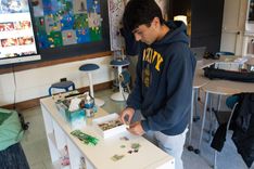 A student working on a puzzle in the Wellness Room at Cranford High School.
